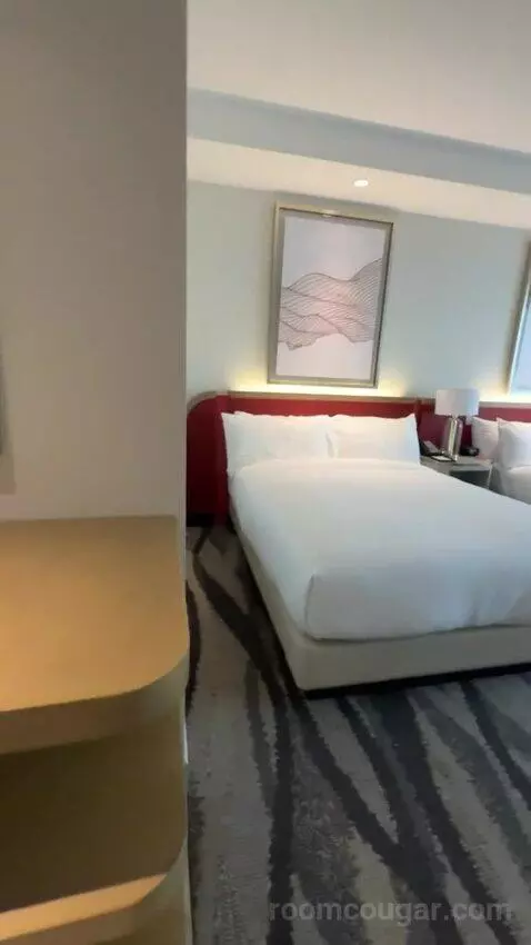 Premium Queen Room with Two Queen Beds and City View bed picture #3