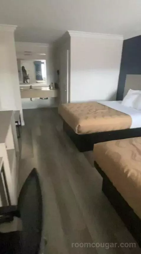 Queen Room with Two Queen Beds (#106) bed picture #11