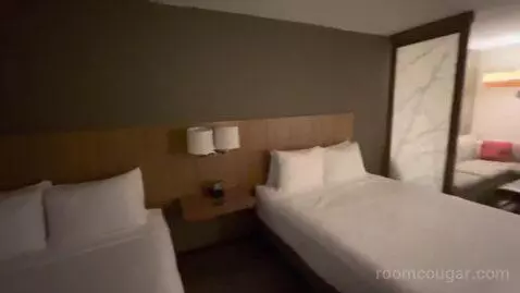 Queen Room with Two Queen Beds and Sofa Bed (#605) bed picture #9